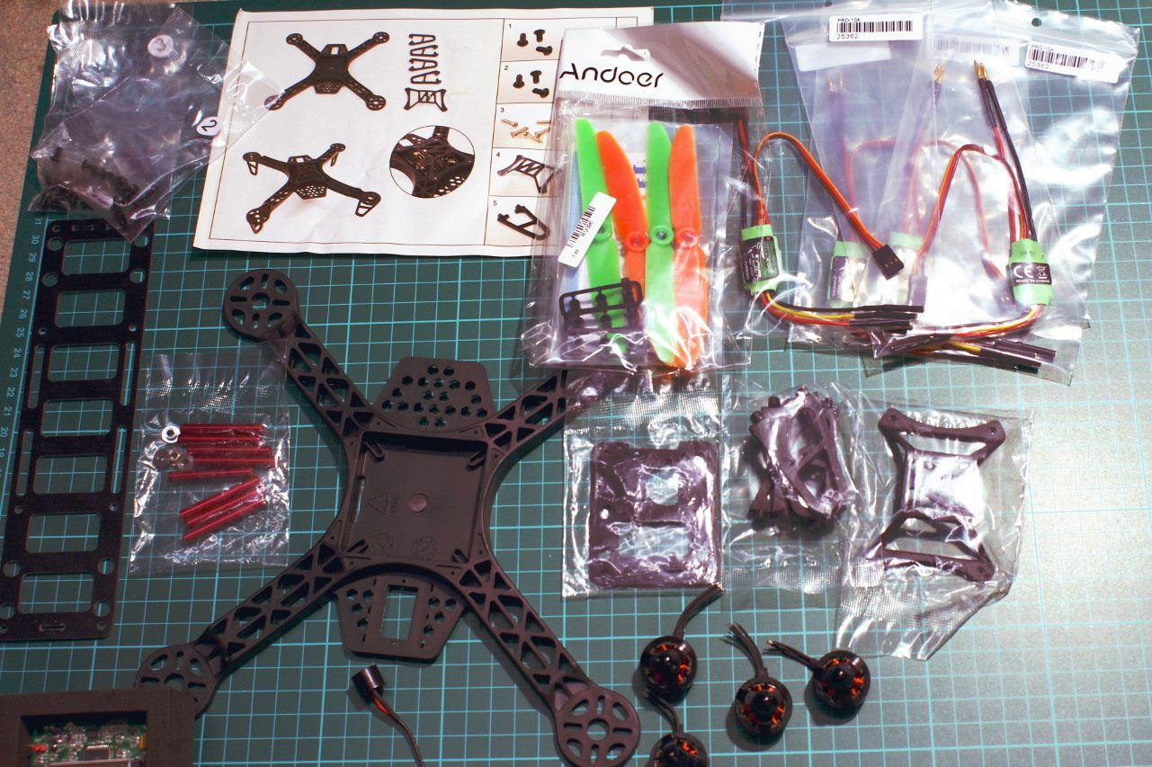 Quad copter parts laid on bench